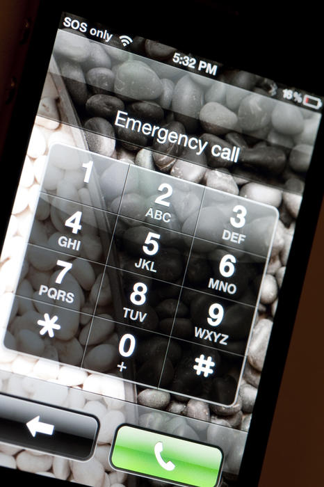 a mobile phone display with Emergency call on the screen