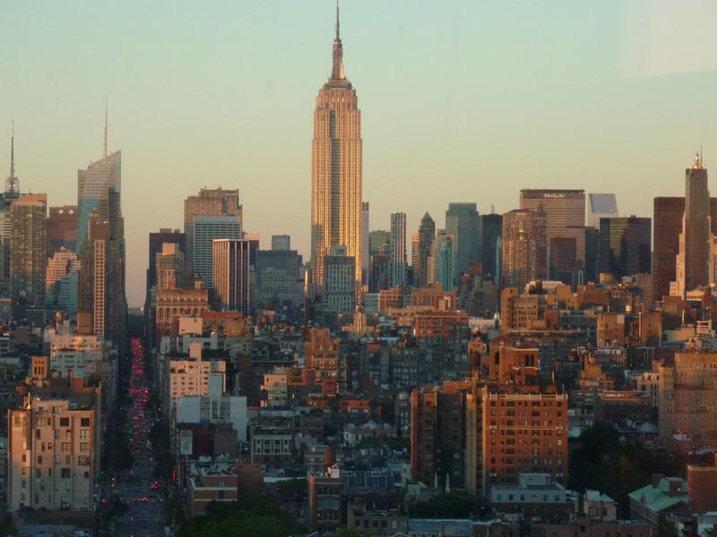 Evening view of the Empire State Building, Manhattan, New York catching the last rays of the sun as it towers above the other skyscrapers on the skyline