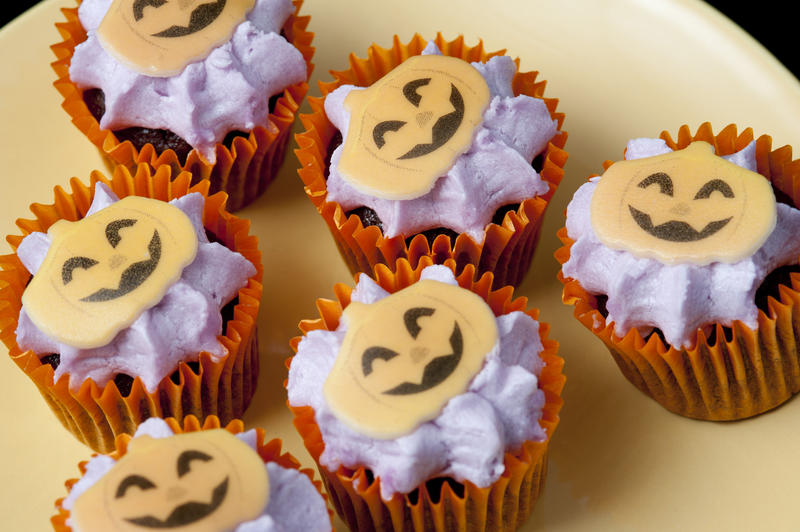 a plate of small haloween party treats with pumpkin decorations