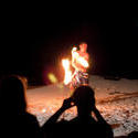 6330   Tourists watching Fijian fire dancers