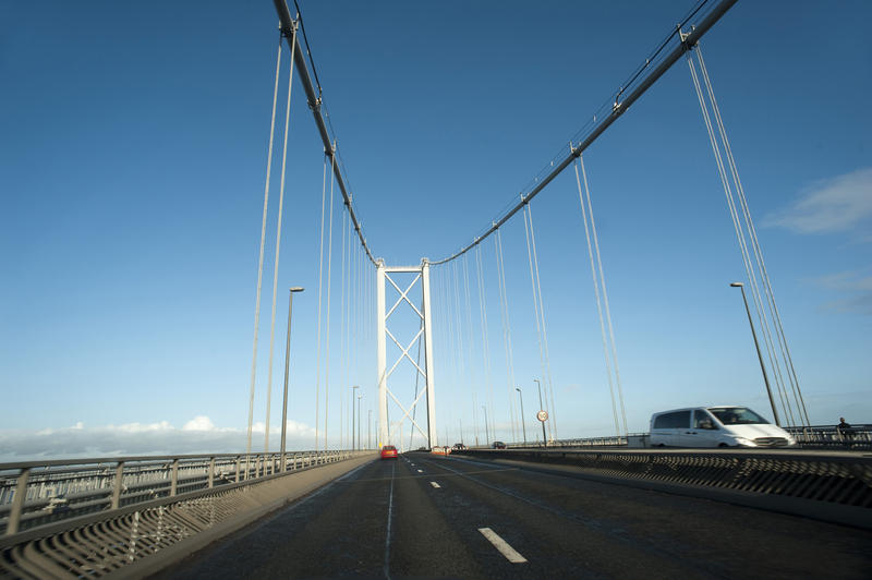 View along the highway while driving across the Forth Road Bridge, a suspension bridge crossing the Firth of Forth in Edinburgh, Scotland
