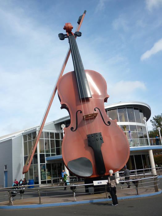 Ceilidh fiddle on the roadside in the waterfront Sydney, Nova Scotia to celebrate the influence of Scottish fiddle music in the area