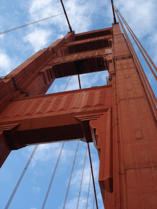 looking up at the towers of the golden gate bridge, san francisco