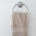 6923   Beige hand towel hanging in a bathroom