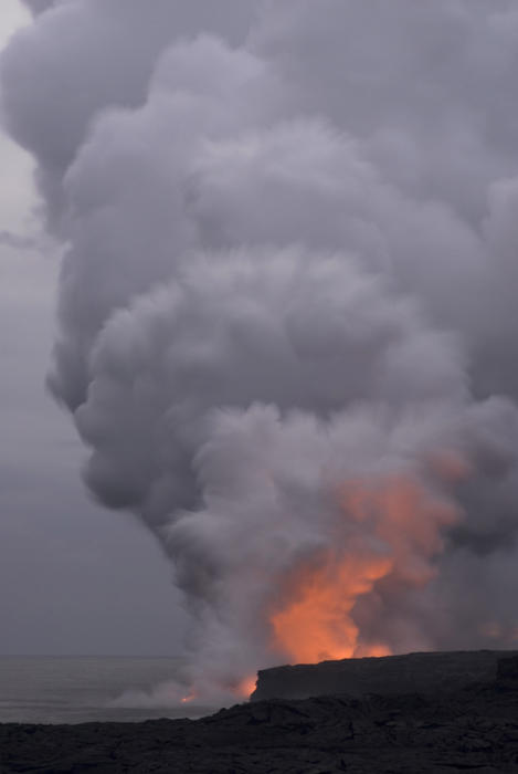 clouds of steam errupt from the Kalapana lava flow