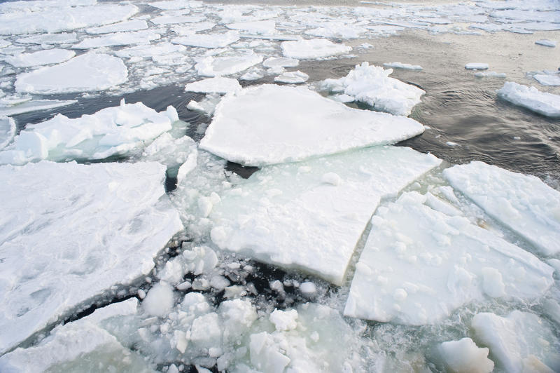 broken drift ice floting on an ice cold winter ocean, Northern japan