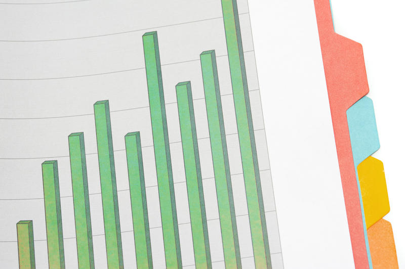 Increasing bar graph in a folder with blank index tabs inserted as part of a statistical chart report