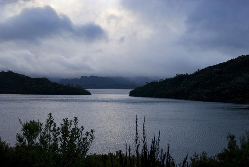 dramatic stormy clouds over lake pedder, tasmania