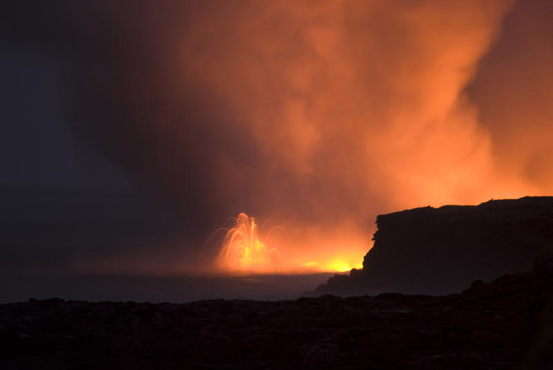 lava erruption spewing hot rock and gas clouds into the air, near Kalapana, Hawaiis Big Island 