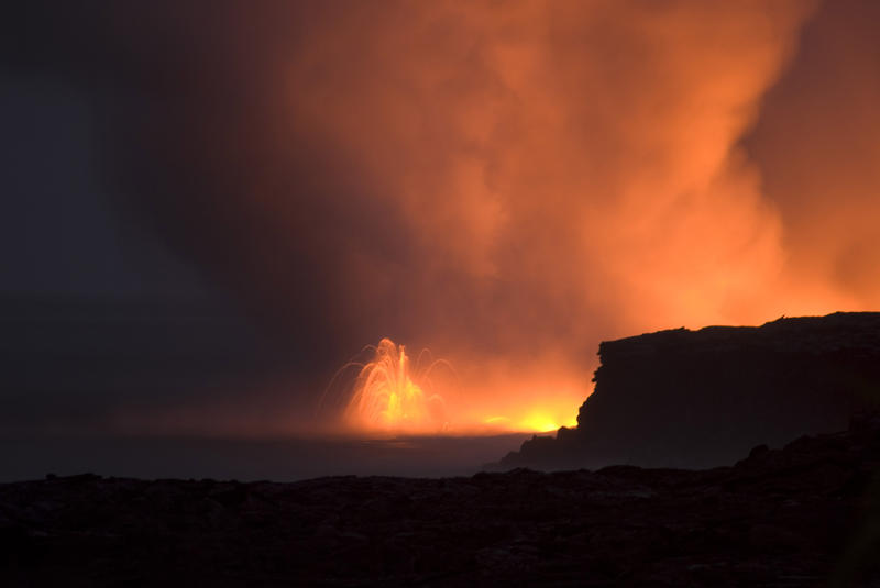 lava erruption spewing hot rock and gas clouds into the air, near Kalapana, Hawaiis Big Island