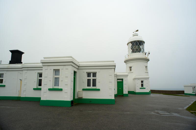 lighthouse and watchmans cottages in the traditional trinity style, pendeen cornwall