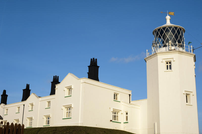 Lizard Lighthouse, Cornwall on Lizard Point, which is the southernmost tip of the United Kingdom, serves as a warning to ships of the rocky hazard as they enter the English Channel