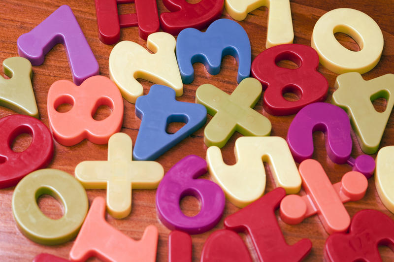 Closeup background of colourful plastic numbers for teaching mathematics