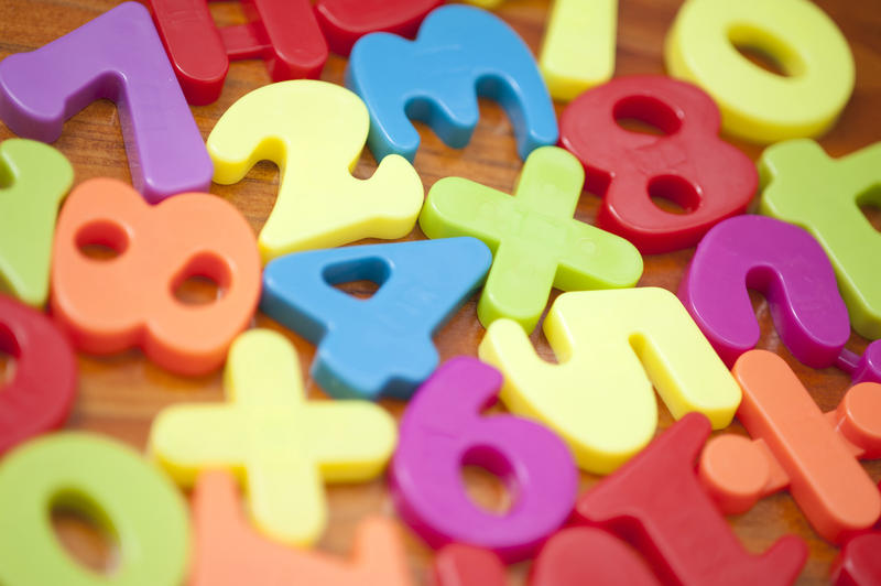 Closeup background of colourful plastic numbers for teaching young children mathematics