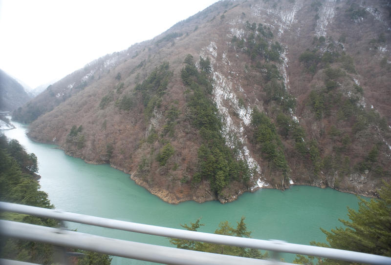 green coloured mineral rich snow melt water in the mountains of central japan