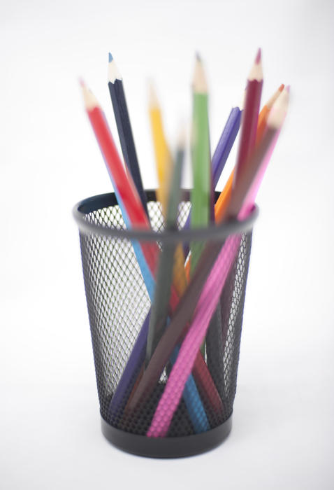 Colored pencils in black pencil basket - pictured with a shallow DOF