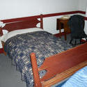 6770   Double wooden bed with side tables