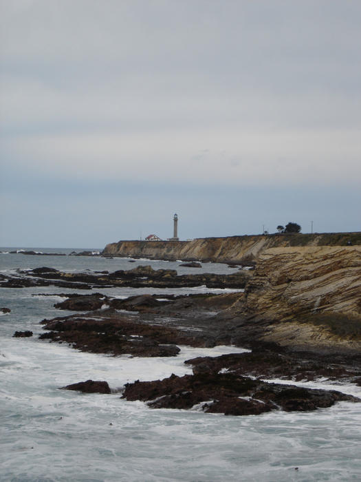 rocky coastline at point arena with the lighhouse in the distance, Mendocino County, California