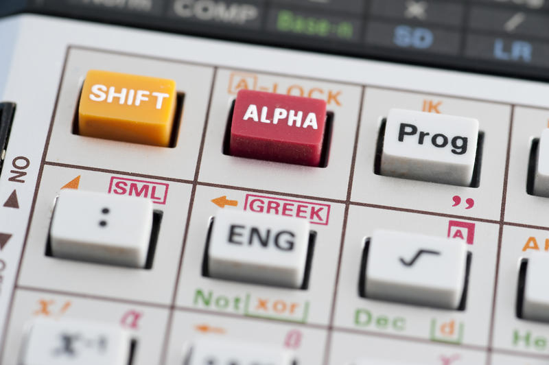 Closeup background of the keys on a complex programmable calculator