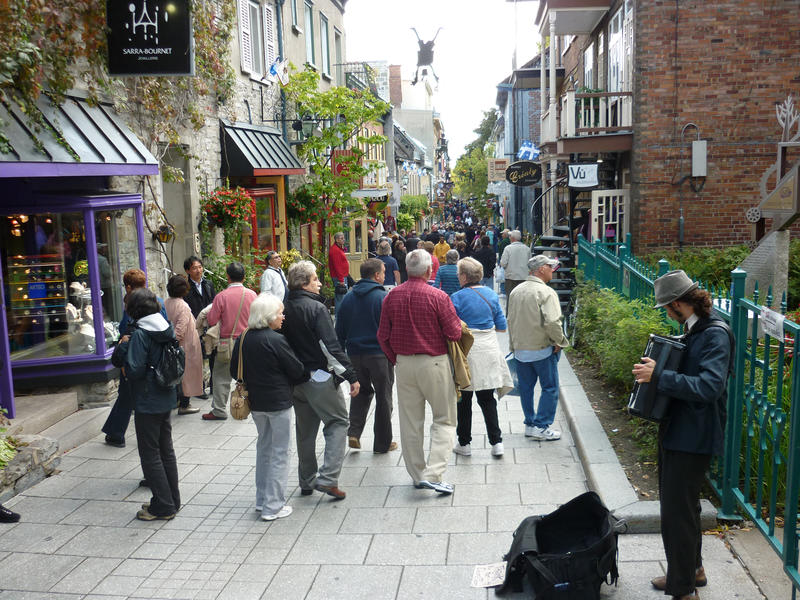 Pre Corona Virus: Tourists and locals enjoy the shopping and street entertainment of Quebec