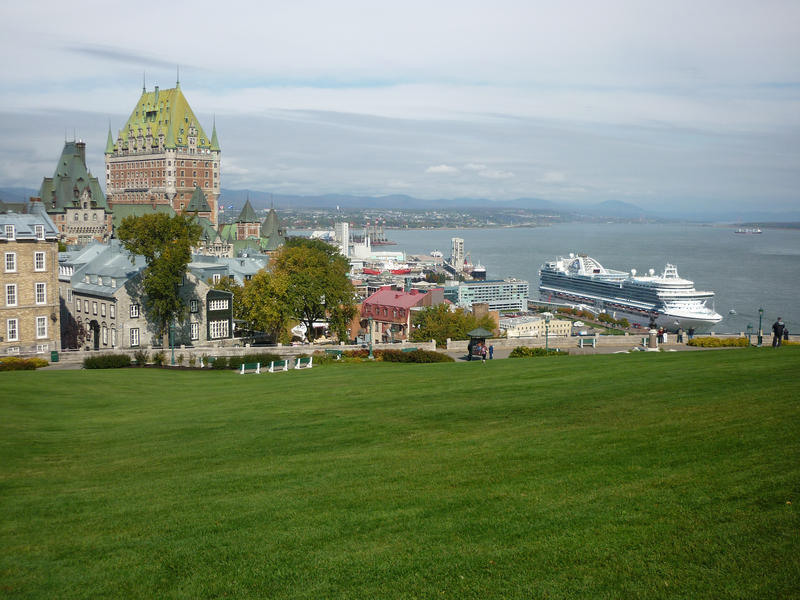 View of Quebec harbour, Canada, with old historical buildings and a large passenger cruise liner tied to the wharf