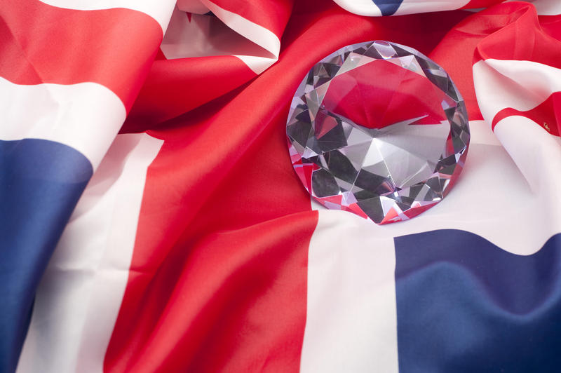 a large diamond resting on a union jack flag background