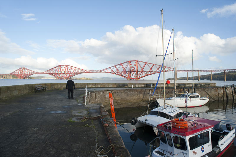 Queensferry harbour, Scotland with a view across the Firth of Forth to the Forth Rail Bridge on the skyline