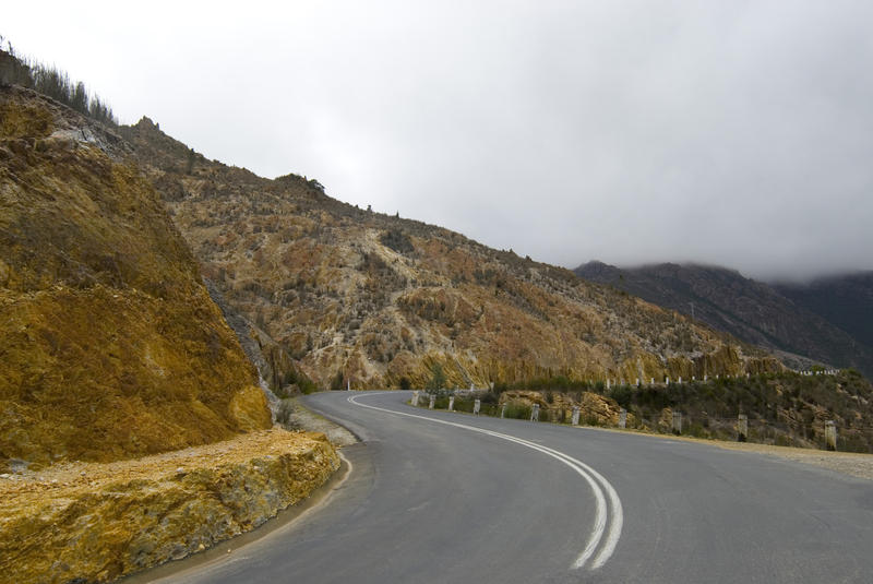 highway through mine spoil heaps on the way to queenstown tasmania