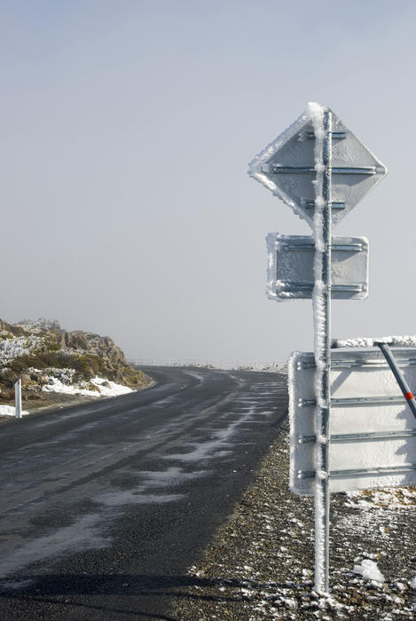 frost blown by the wind built up on a roadsign, mount wellington, tasmania