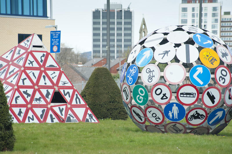 Magic Roundabout ot The Landmark, Splott, Cardiff is a traffic circle on which Pierre Vivant erected sculptures formed from traffic signs