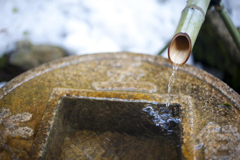 Tsukubai at Ryoan-ji, water running from a kakei pipe