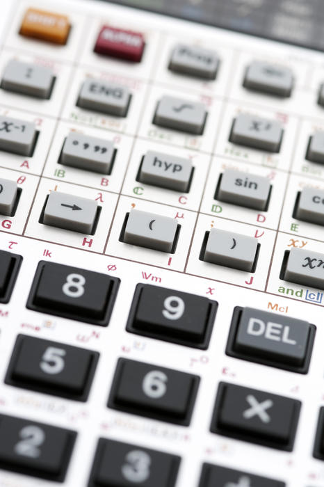 Keypad of a scientific calculator showing various numbers and mathematical functions