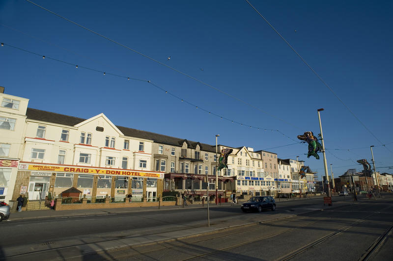 Exterior facade of a row of Blackpool guesthouses which overlook the waterfront