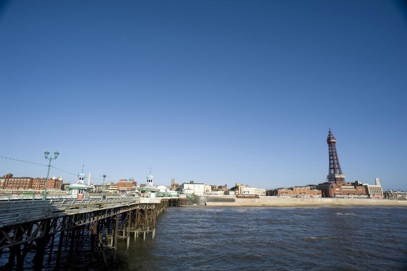 View from the Blackpool North Pier of the shoreline and waterfront with the historic Blackpool Tower