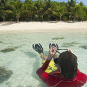 6301   Snorkeler donning his mask