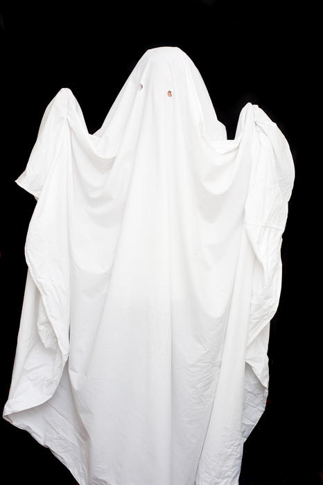 halloween ghost outfit made from a white bed sheet