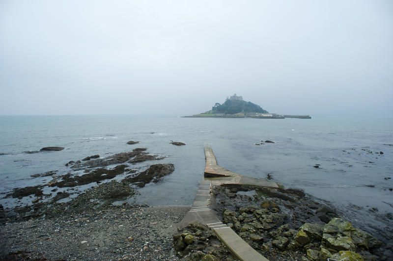 From mainland Cornwall looking across to St Michaels Mount. At low tide it is possible to walk across the causeway to the Mount