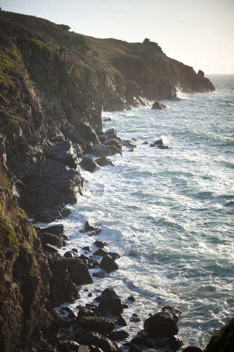 waves breaking over rocks on the cornish coast near bass point