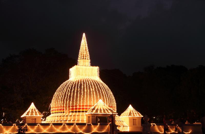 <p>Buddhist temple illuminated at night on full moon day, Kelaniya, srilanka</p>Buddhist temple illuminated at night, Kelaniya Srilanka