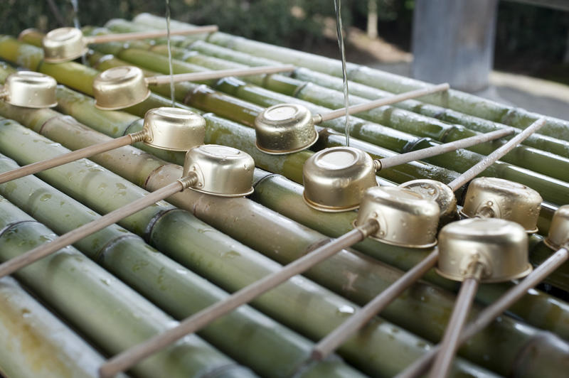 water dripping from kakei at a tsukubai used for ritual cleansing at the Todai Ji temple Nara, japan