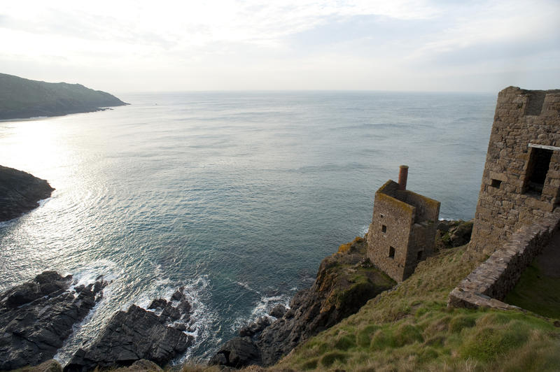 View of the ruined cliff top engine houses at Crown Mines, Cornwall overlooking the Atlantic ocean and the submarine or undersea shafts which now form part of the Cornwall and West Devon Mining Landscape World Heritage site