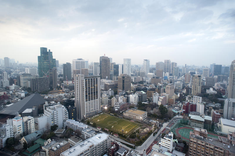 a grey cloudy day looking out across the office buildings of central tokyo, Japan