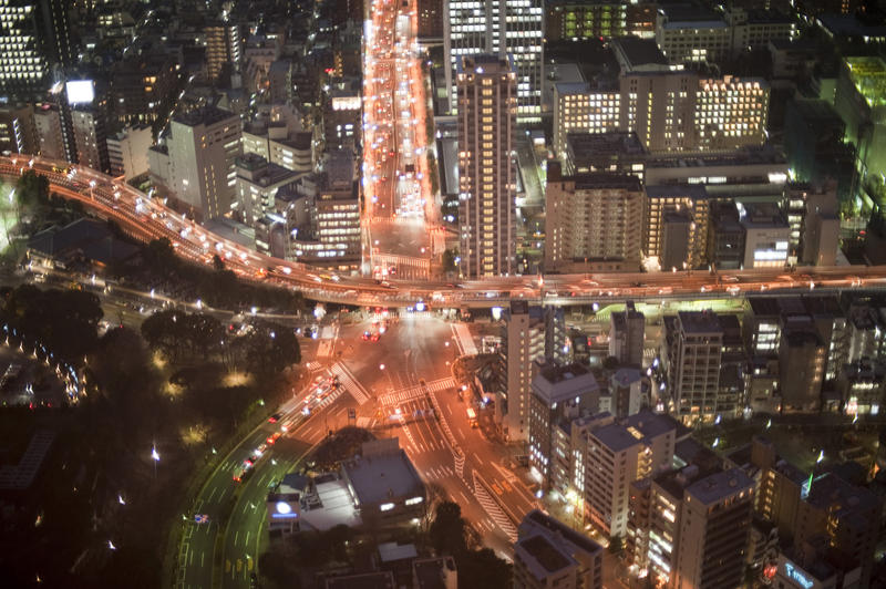 looking down on a five way intersecton at night, tokyo, japan