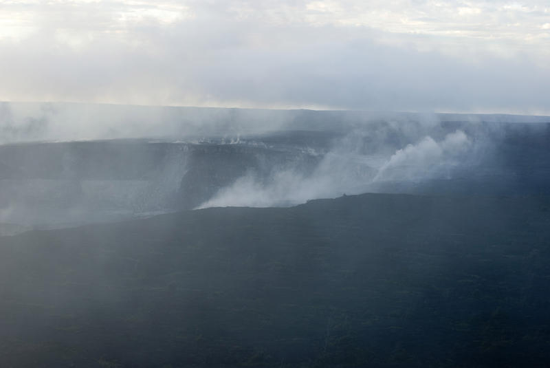 smoke, steam and volcanic gasses rising from the kilauea volcano, big island hawaii