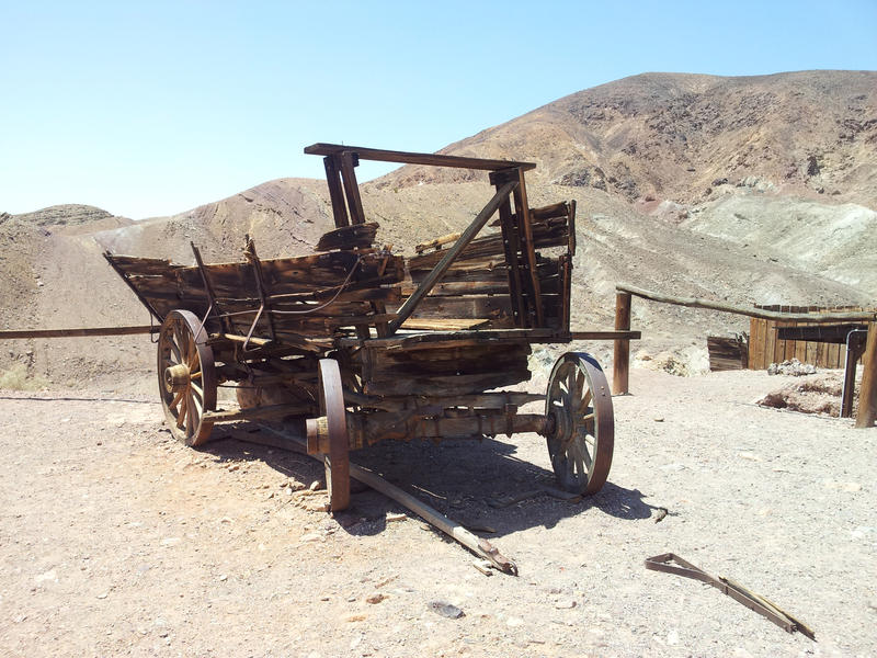 <p>Broken wagon in a desert.</p>