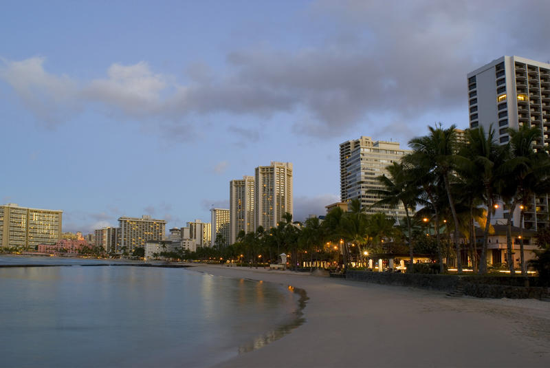 Sunrise over the highrise resort hotels at waikiki beach, honolulu, hawaii.