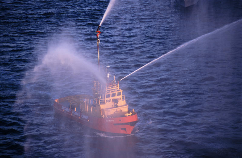 a fire fighting boat spraying water from water cannons or monitors