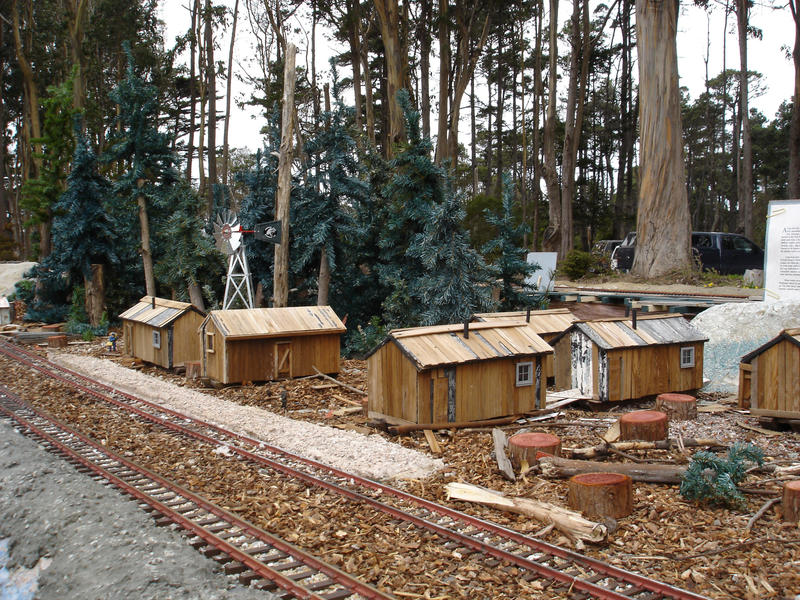 a model railway and wooden cabins