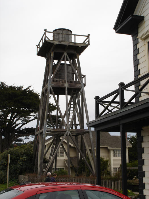 a wooden bulit water tower with two water tanks