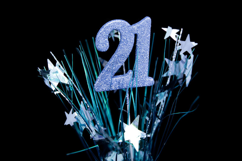 Close up 21st Celebration Design Concept with Bursting Stars Isolated on Black background.